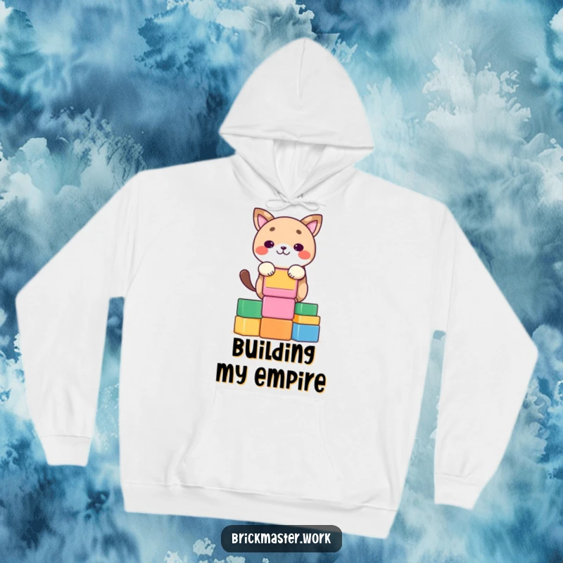 Funny kawaii animal concentrating on stacking colorful blocks on a warm, soft hoodie.